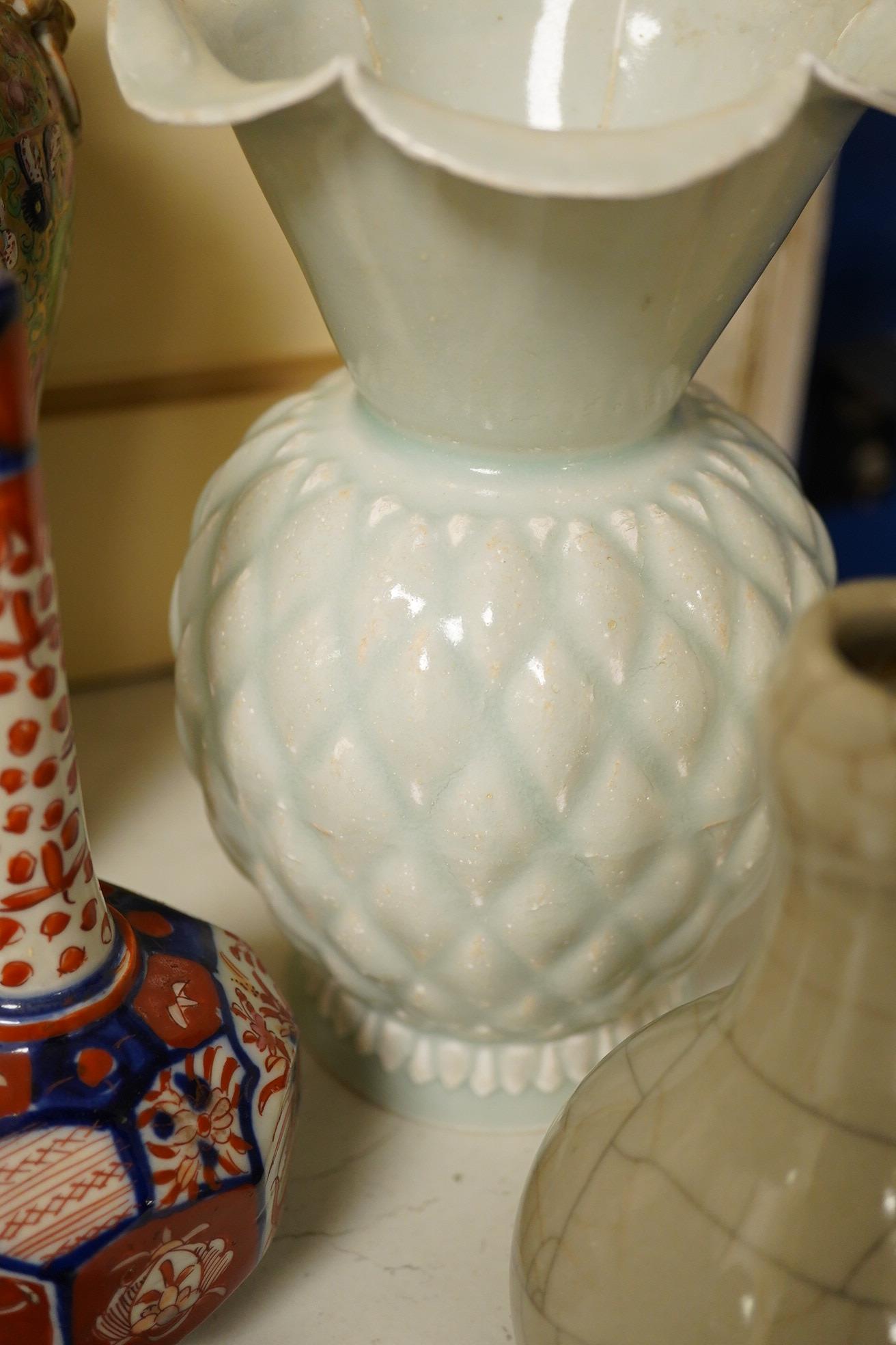 A Chinese Canton pattern vase, crackle glazed bottle vase, pale green vase, a Japanese Imari bottle vase and another cover, famille rose vase 24cm high. Condition - poor to good